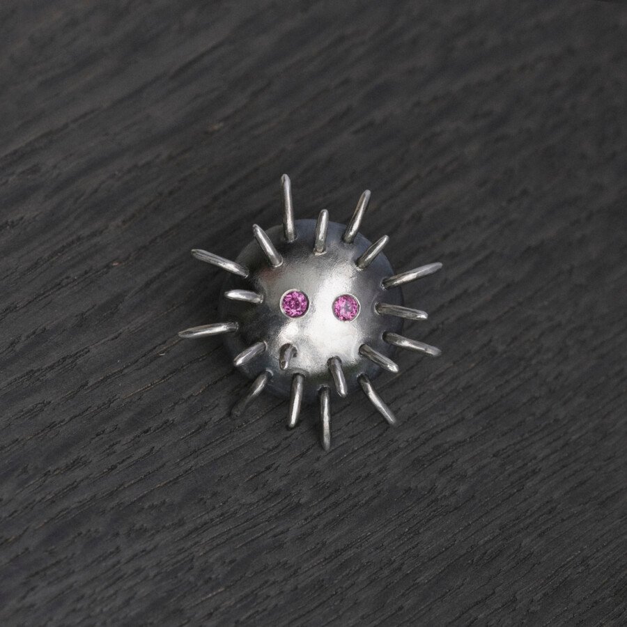 Silver Pin "Trickster" with Rhodolites